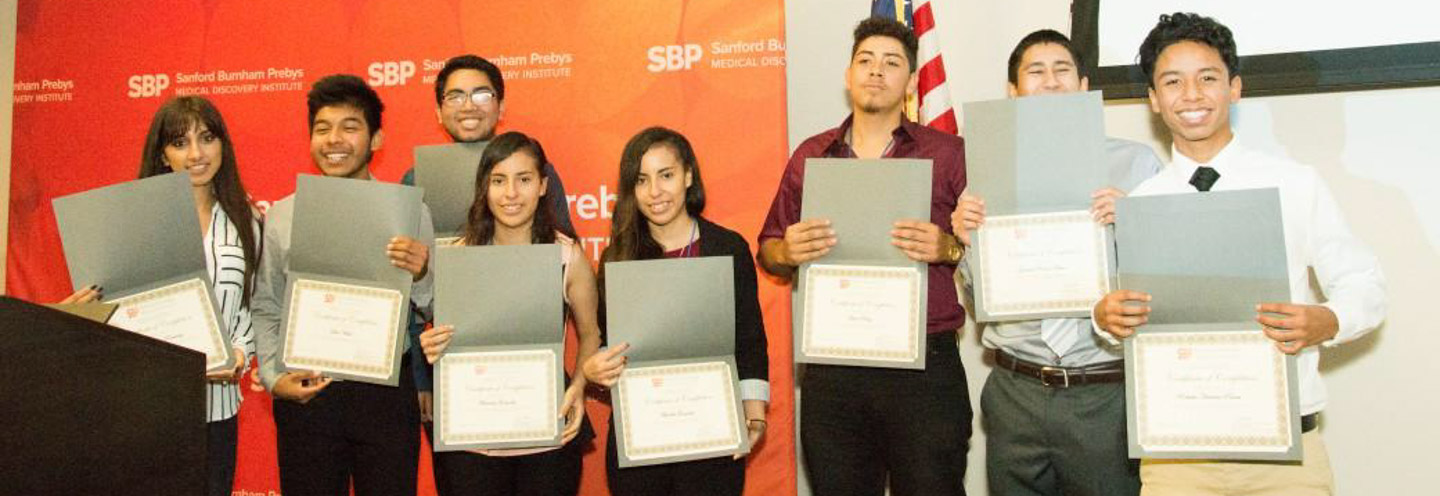 Eight high school interns with their certificates