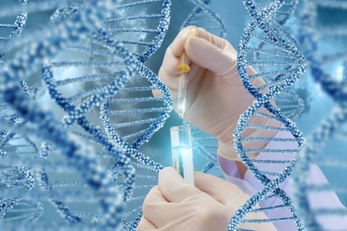 DNA research with a sample. Hand with a test tube on a DNA background shutterstock_653790793.jpg