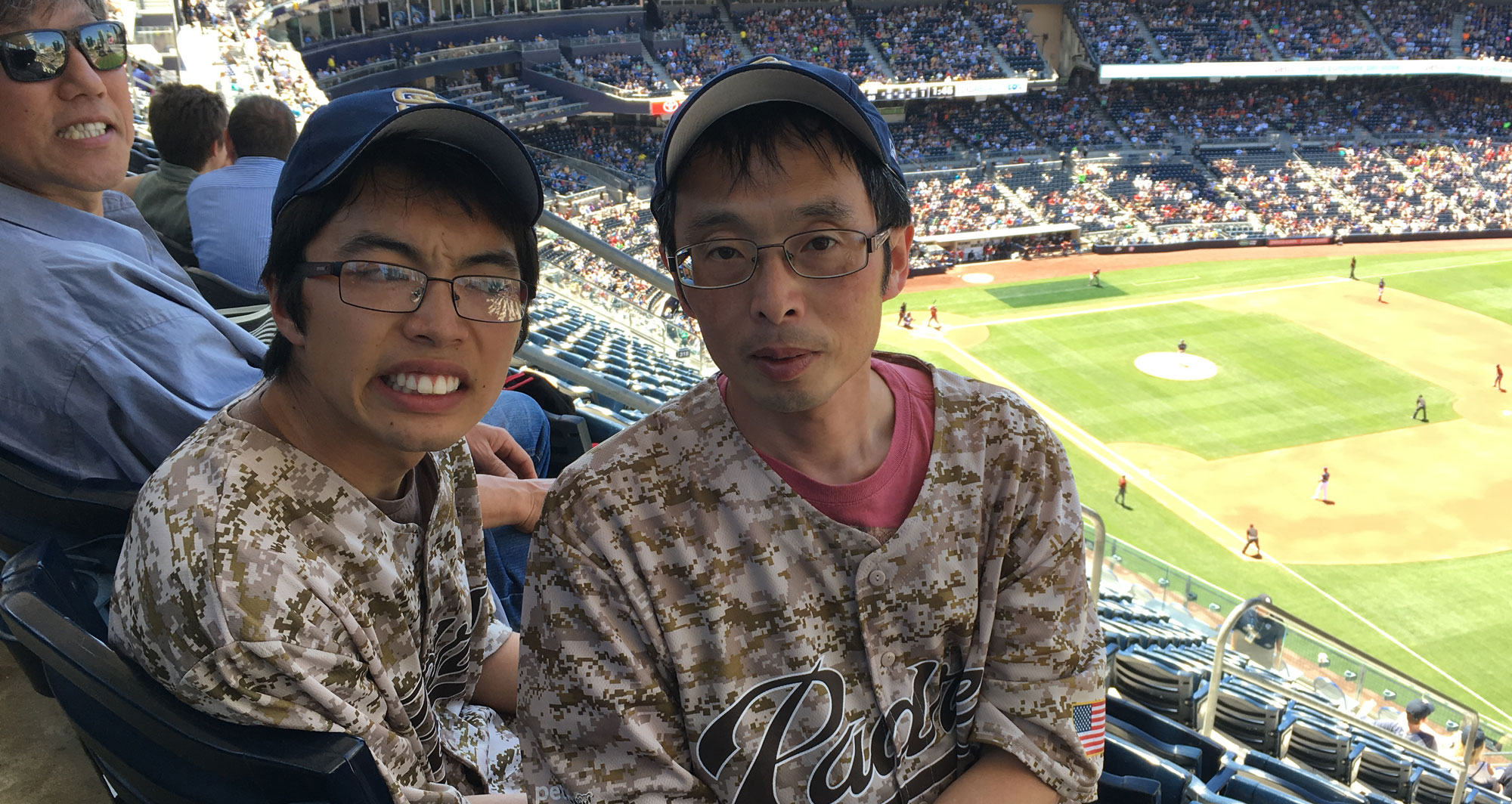 Fumitoshi Irie and his son at a baseball game