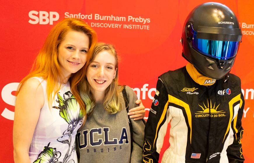 17-year-old Madison Koslowski (right), who was diagnosed last year with juvenile idiopathic arthritis, poses with race-car driver Angela.