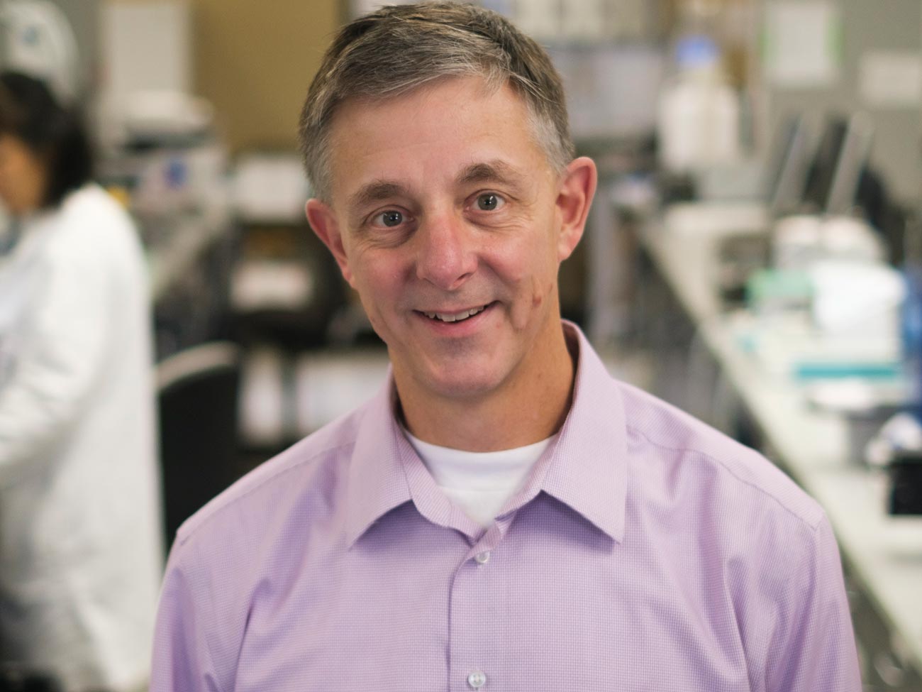Steven Olson, PhD, headshot in lab