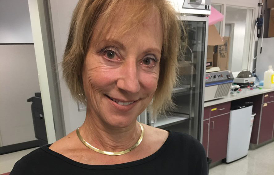 Sanford Burnham Prebys assistant professor Karen Ocorr standing in her lab