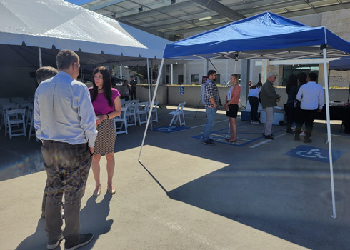 trainees and faculty enjoying refreshments