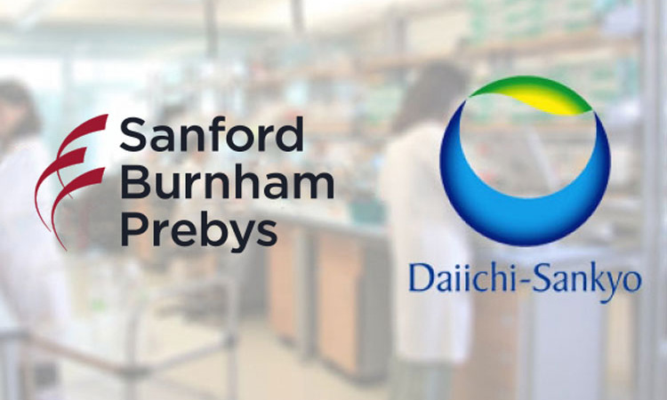 Image showing Sanford Burnham Prebys and Daiichi Sankyo logos overlayed over an image of people working in a lab