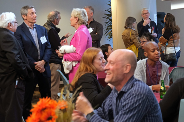 Open House guests conversing in Chairmen's Hall