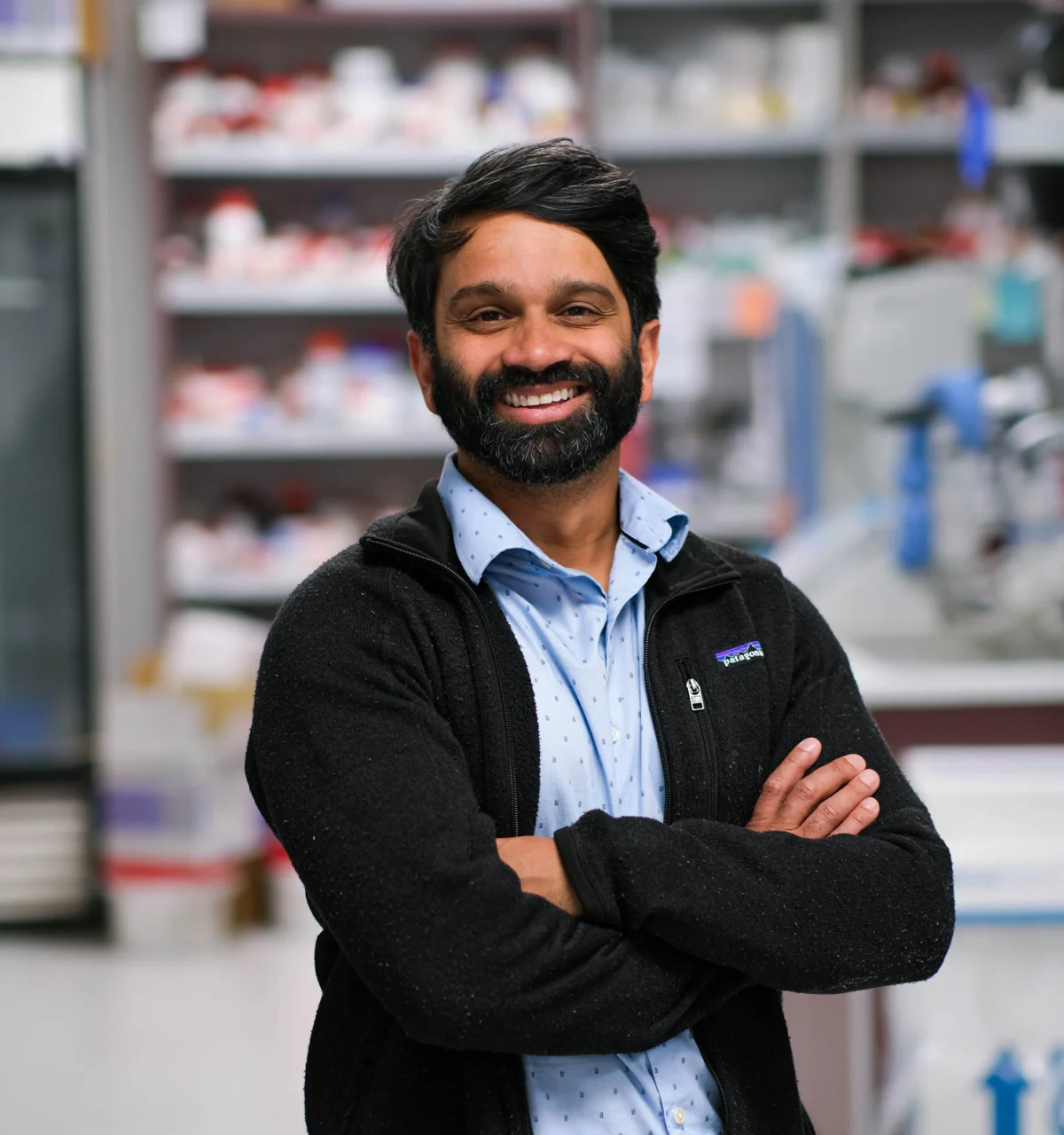 Sanjeev Ranade, PhD, headshot in lab