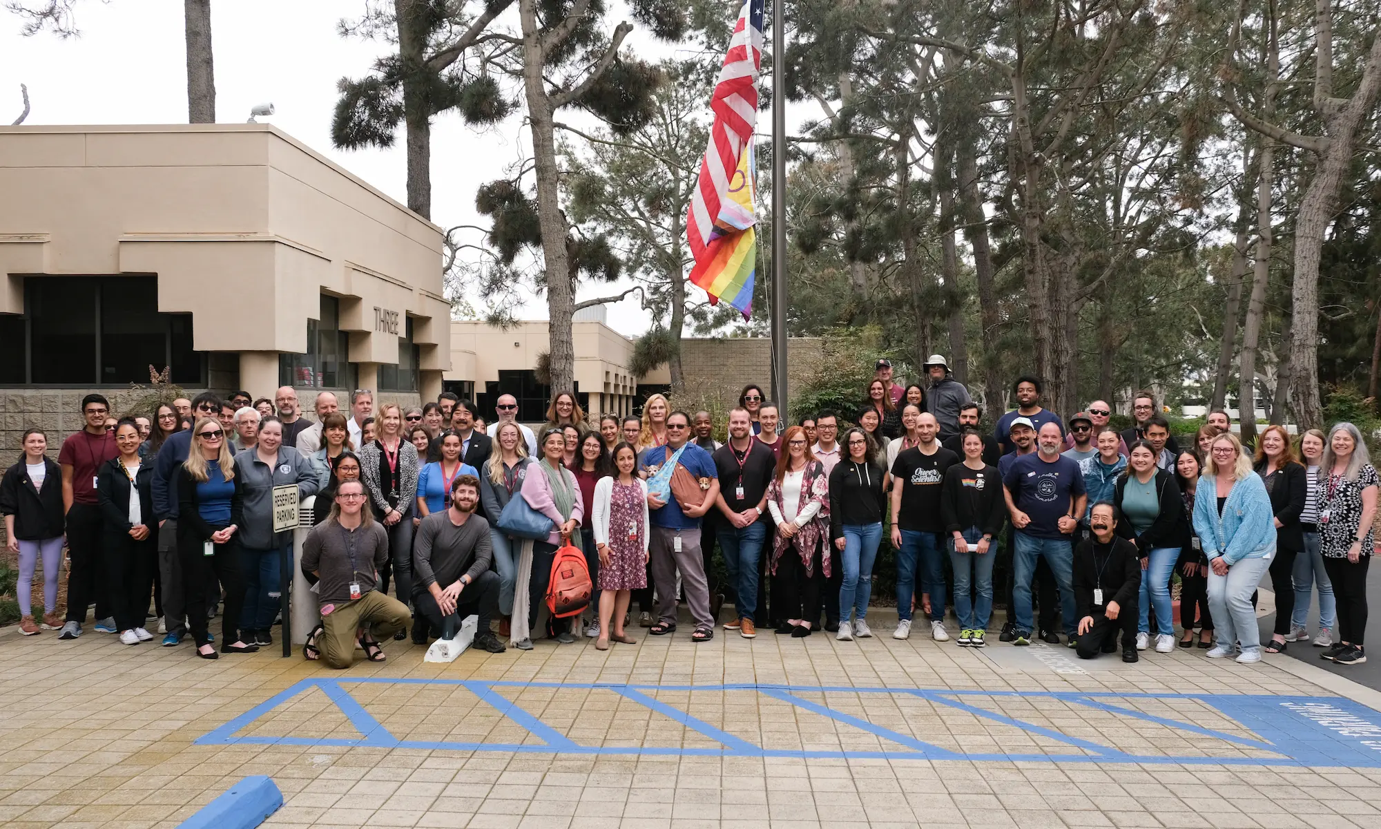 Pride flag raising - group photo