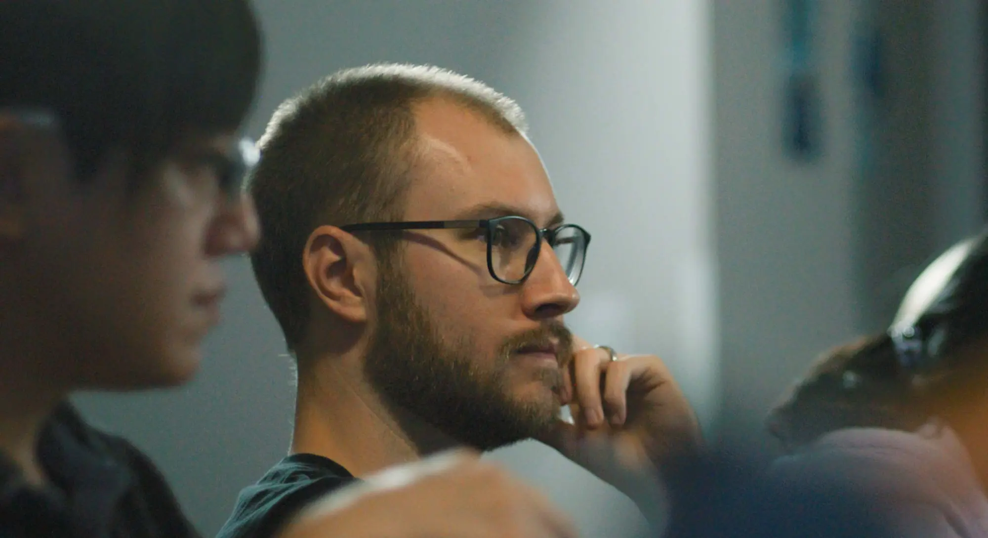 A closeup of a man in an event audience