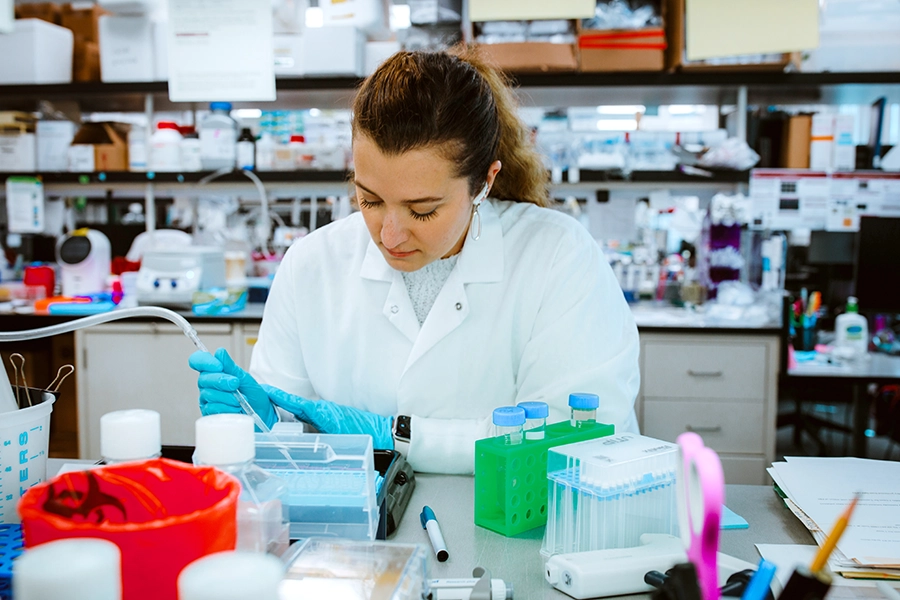 A scientist works at a laboratory bench in Building 12 on the Sanford Burnham Prebys campus.