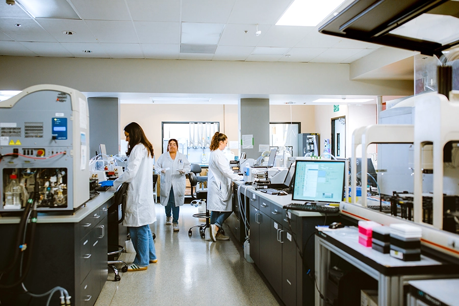 Scientists at work at the Conrad Prebys Center for Chemical Genomics at Sanford Burnham Prebys. To screen up to 750,000 chemicals to find new drug candidates, highly miniaturized arrays are used in which 1536 tests are conducted in parallel. Experiments are miniaturized to such an extent that hand pipetting is not possible and acoustic dispensing (i.e. sound waves) is used to precisely move the tiny amounts of liquid in a touchless, tipless automated process.