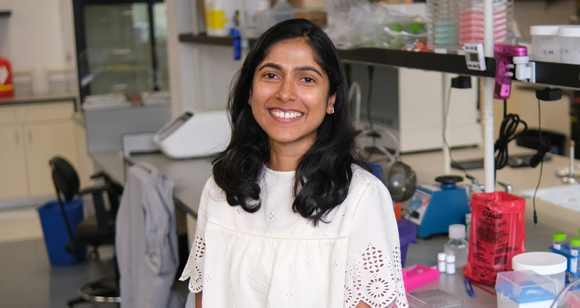 Meena Sudhakaran profile photo in the lab - image credit: Sanford Burnham Prebys