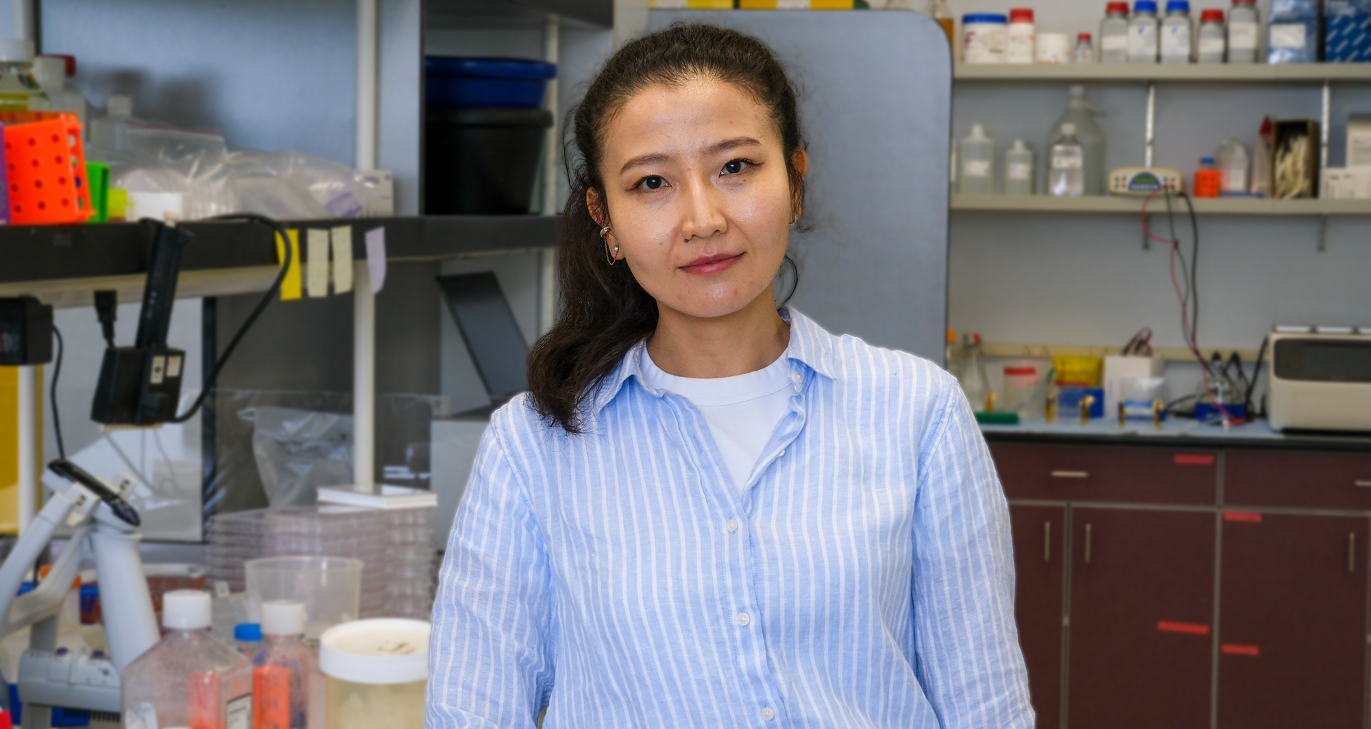 Arailym Sarsembayeva, PhD, profile photo in lab. Photo credit Sanford Burnham Prebys
