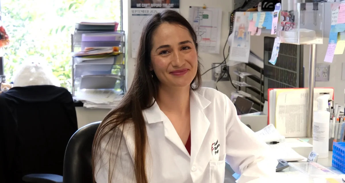 Dana Mamriev, PhD, profile photo in lab. Photo credit Sanford Burnham Prebys