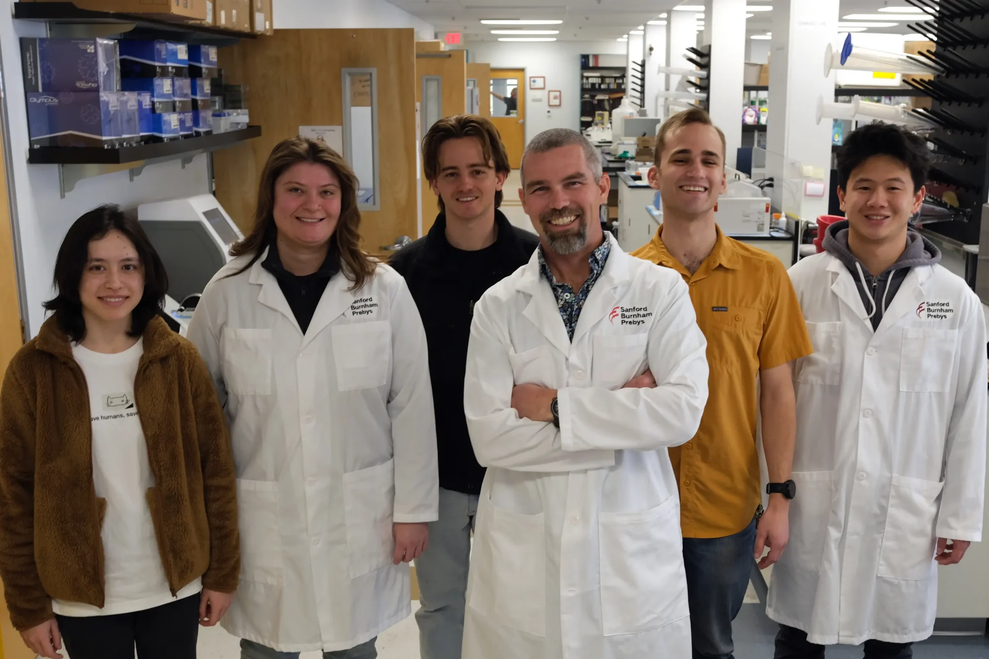 Tharp Lab group photo in the lab. Image credit Sanford Burnham Prebys