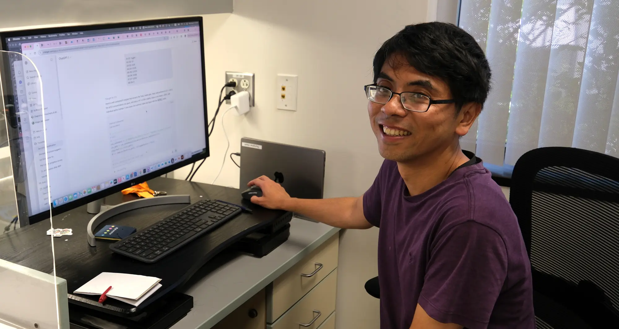 Tsunghan Hsieh, PhD, profile photo at computer. Photo credit Sanford Burnham Prebys