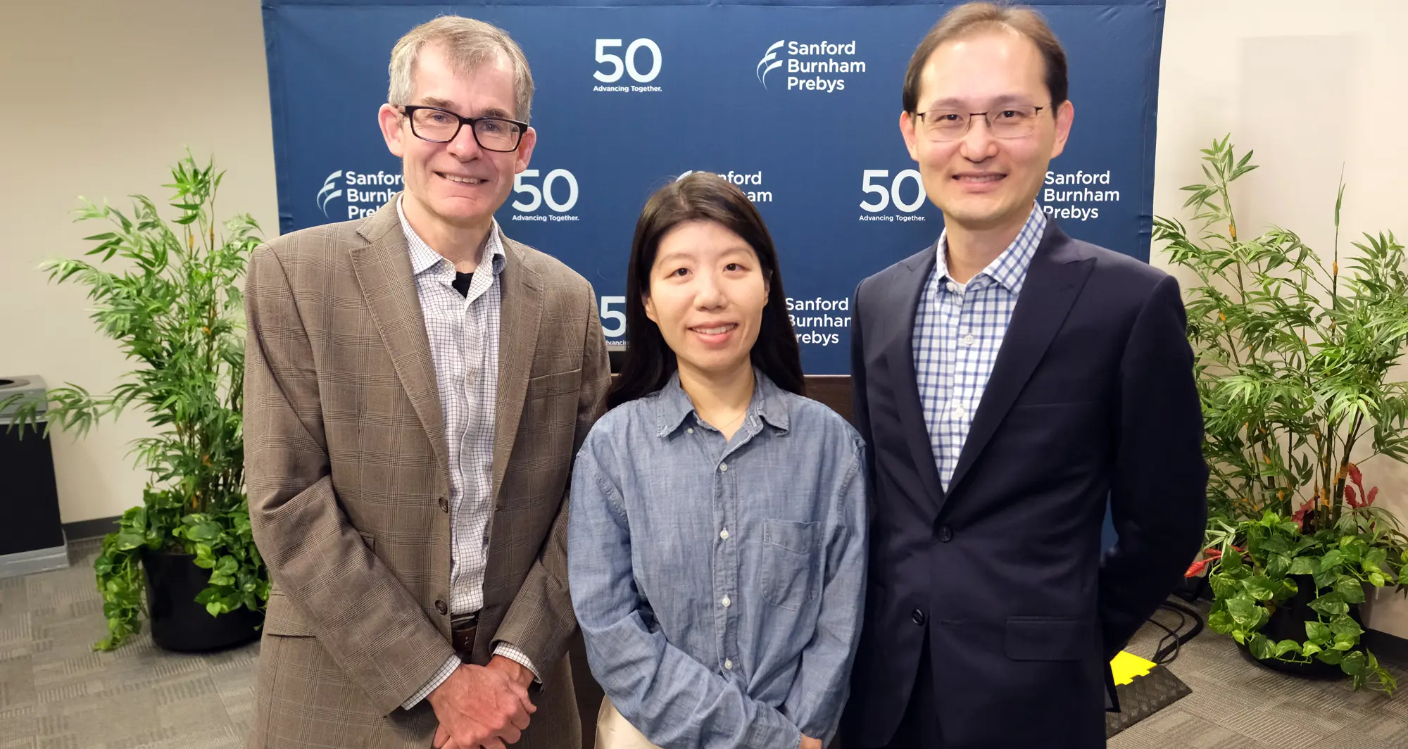 Peter Adams, PhD, with scholarship recipient Shanshan Yin, PhD, and Kevin Yip, PhD.