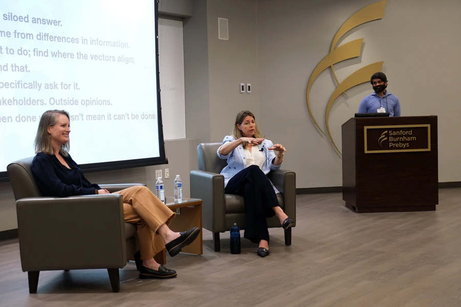 Kelly Kersten and Erica Ollmann Saphire with fireside chat moderator and cardiovascular researcher Sanjeev Ranade, PhD. Image credit: Sanford Burnham Prebys.