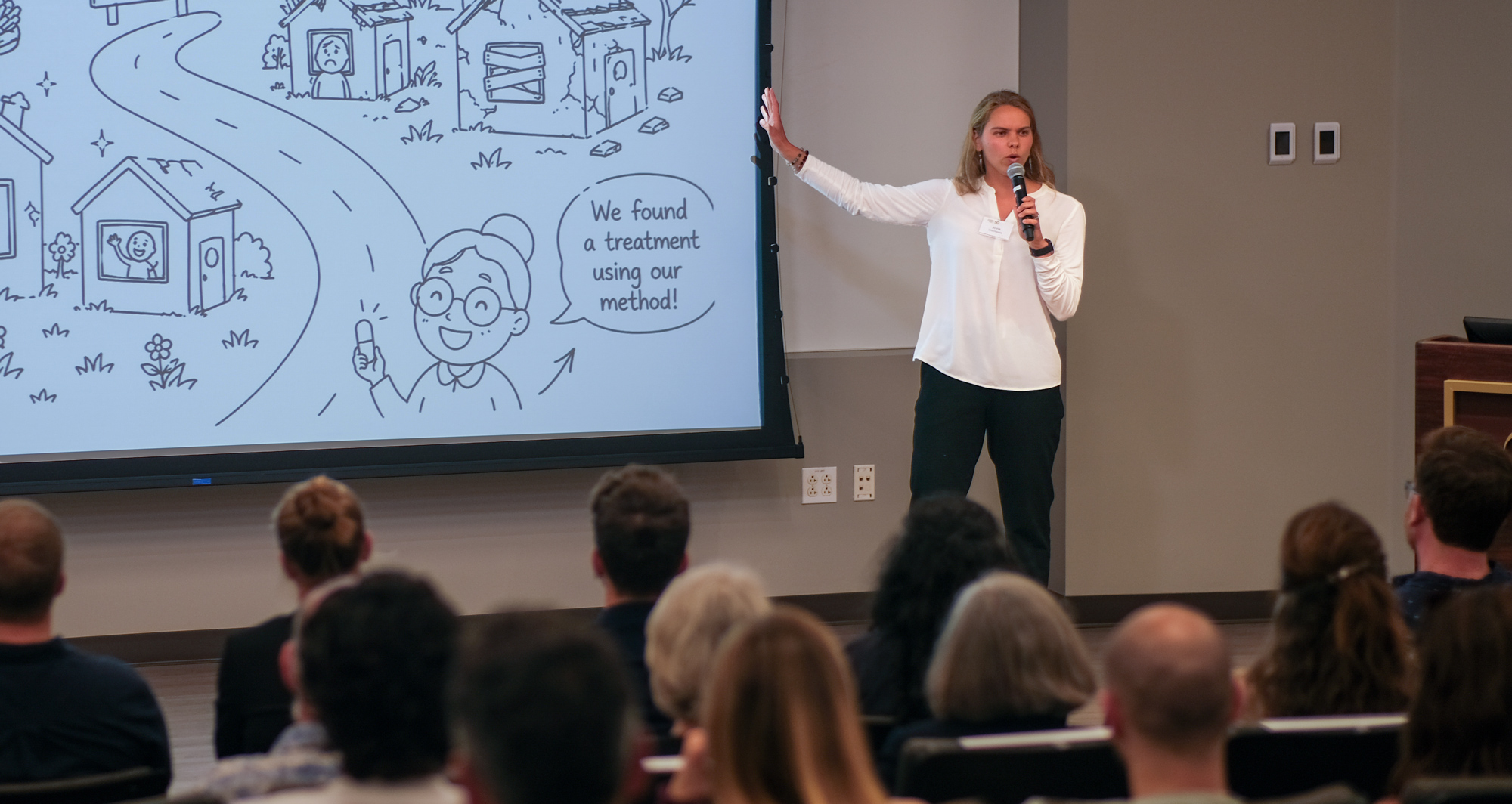 Anna Checheninia presenting at the Outreach Symposium