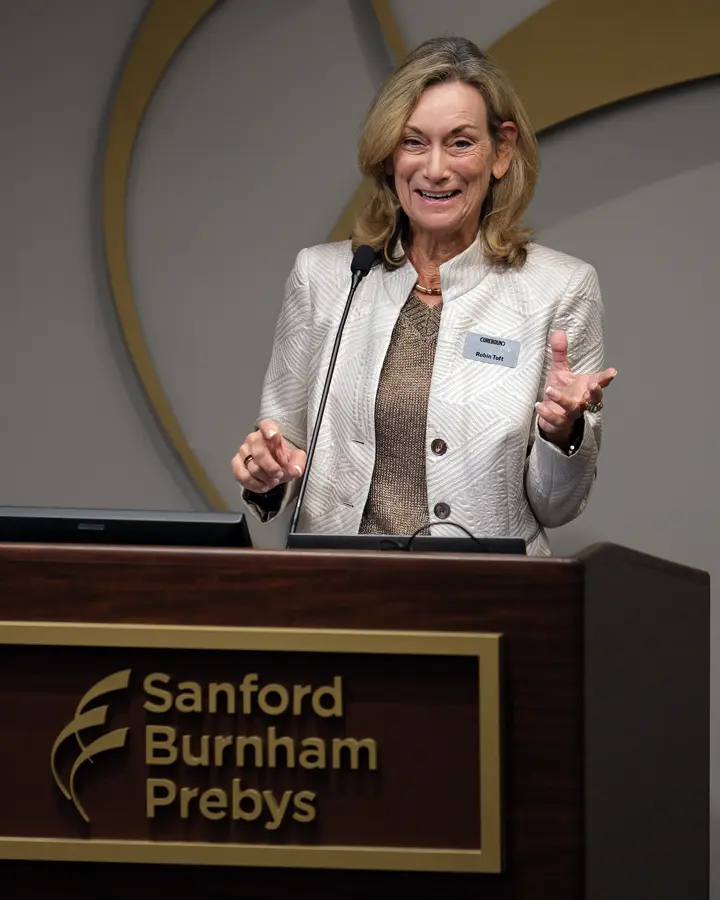 Robin Toft, CEO of Cureboung, speaking at the podium